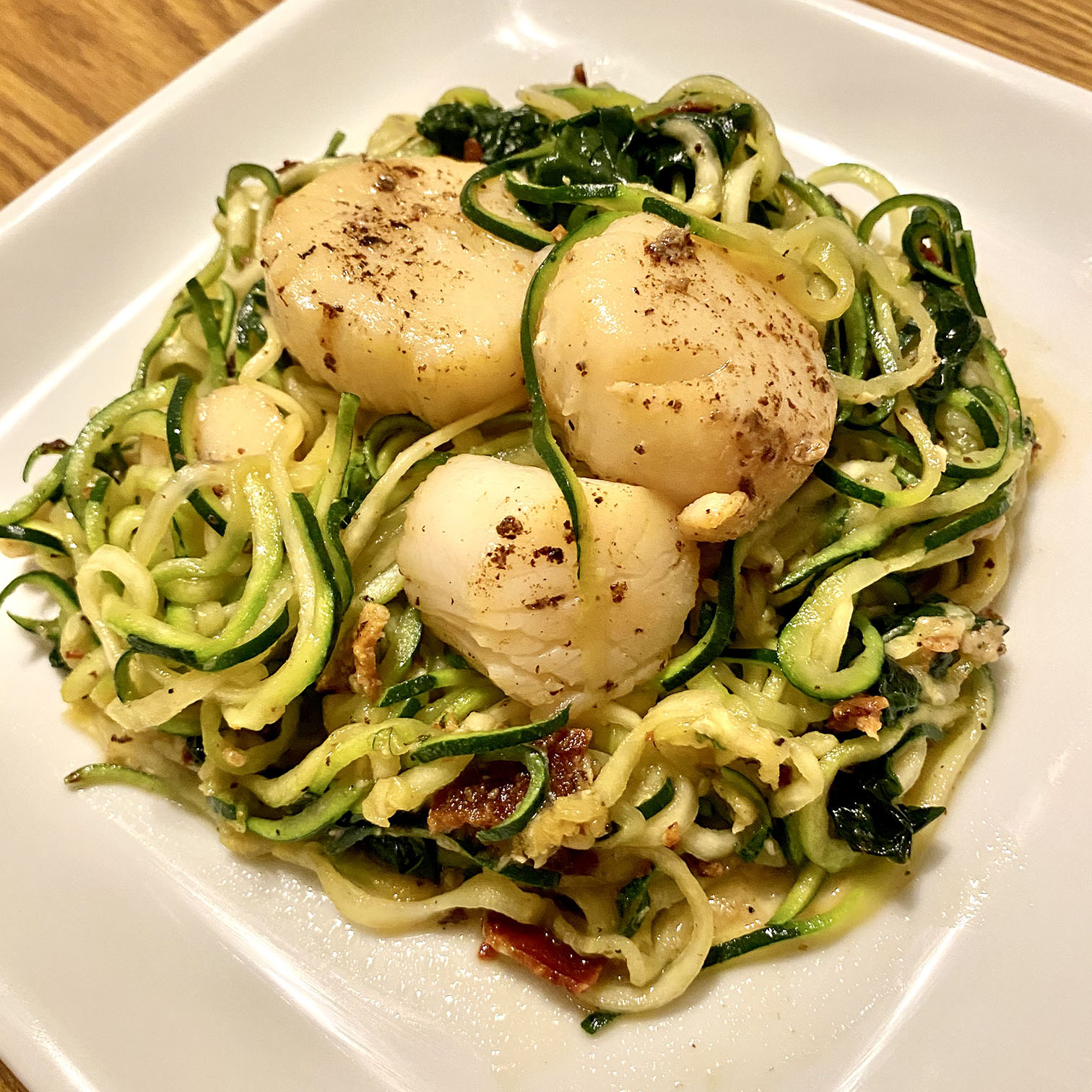 Zucchini Noodles with Bacon, Garlic, and Scallops - Girl Plus Food